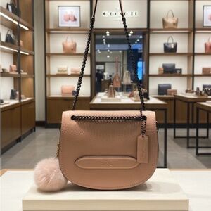 Coach saddle bag style peach pink color